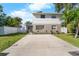 Two-story house with a landscaped yard and driveway at 4220 19Th N St, St Petersburg, FL 33714