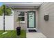 Inviting front entrance with a teal door and welcome mat at 4220 19Th N St, St Petersburg, FL 33714