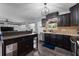 Stylish kitchen with dark cabinets, stainless steel appliances and an island at 4220 19Th N St, St Petersburg, FL 33714