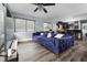 Spacious living room with dark hardwood floors and a blue couch at 4220 19Th N St, St Petersburg, FL 33714