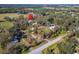 Aerial view showing home's location on large lot with surrounding trees at 4501 Keene Rd, Plant City, FL 33565