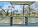 Screened porch overlooks a large grassy backyard with trees at 4501 Keene Rd, Plant City, FL 33565