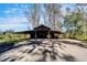 Large metal barn with covered parking and open sides at 4501 Keene Rd, Plant City, FL 33565