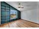 Bedroom with wood floors, built-in shelves, and window at 4501 Keene Rd, Plant City, FL 33565