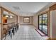 Bright dining area with tile floors and view to patio at 4501 Keene Rd, Plant City, FL 33565