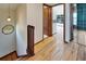 Upstairs hallway with wood floors and access to other rooms at 4501 Keene Rd, Plant City, FL 33565