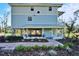 Two-story light blue house with landscaped yard at 4501 Keene Rd, Plant City, FL 33565