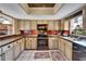 Updated kitchen with stainless steel appliances and wood cabinets at 4501 Keene Rd, Plant City, FL 33565