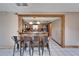Kitchen with breakfast bar and view into dining area at 4501 Keene Rd, Plant City, FL 33565