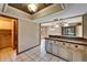 Eat-in kitchen with wood cabinets, modern appliances, and a breakfast bar at 4501 Keene Rd, Plant City, FL 33565