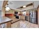 Modern kitchen with stainless steel appliances and wood cabinets at 4501 Keene Rd, Plant City, FL 33565