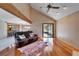 Open living space with hardwood floors, a fireplace and access to a deck at 4501 Keene Rd, Plant City, FL 33565