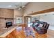 Living room with hardwood floors, fireplace, and access to screened porch at 4501 Keene Rd, Plant City, FL 33565