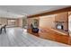 Open living room with hardwood floors, brick fireplace, and vaulted ceilings at 4501 Keene Rd, Plant City, FL 33565