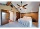 Main bedroom with a king-size bed and access to bathroom at 4501 Keene Rd, Plant City, FL 33565