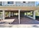 Brick paved parking area under the house with decorative supports at 4501 Keene Rd, Plant City, FL 33565