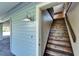 Rustic wooden staircase leading to the upper level of the home at 4501 Keene Rd, Plant City, FL 33565