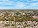 Wide aerial view of community, landscape, and nearby areas at 6506 Remus Dr, New Port Richey, FL 34653