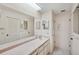 Bathroom with dual sinks, updated countertops, and a tiled floor at 6506 Remus Dr, New Port Richey, FL 34653