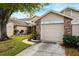Front view of the house with garage and landscaping at 6506 Remus Dr, New Port Richey, FL 34653