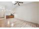 Living Room with vaulted ceiling, wood flooring, and access to patio at 6506 Remus Dr, New Port Richey, FL 34653