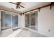 Sunroom with tile floors and sliding glass doors at 6506 Remus Dr, New Port Richey, FL 34653
