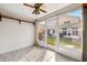 Bright sunroom with sliding glass doors and backyard access at 6506 Remus Dr, New Port Richey, FL 34653
