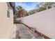 Long and narrow backyard with a high fence at 9104 Sandcroft Ct, Tampa, FL 33615