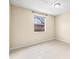 Empty bedroom with a window and tile floor at 9104 Sandcroft Ct, Tampa, FL 33615