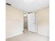 Bedroom with door to another room and tile floor at 9104 Sandcroft Ct, Tampa, FL 33615