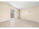 Bright bedroom with large window and tile flooring at 9104 Sandcroft Ct, Tampa, FL 33615