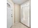Bright entryway with tile floors and white door at 9104 Sandcroft Ct, Tampa, FL 33615