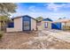 Tan house with blue accents and a spacious driveway at 9104 Sandcroft Ct, Tampa, FL 33615