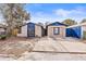 Tan house with blue accents and a spacious driveway at 9104 Sandcroft Ct, Tampa, FL 33615