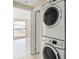 Stackable washer and dryer in a small laundry room at 9104 Sandcroft Ct, Tampa, FL 33615