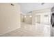 Open living area with tile floors and neutral walls at 9104 Sandcroft Ct, Tampa, FL 33615