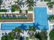 Large pool with surrounding lounge chairs and palm trees seen from above at 100 1St N Ave # 1601, St Petersburg, FL 33701