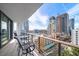City view balcony with small table and chairs at 100 1St N Ave # 1601, St Petersburg, FL 33701