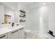 Clean bathroom with a walk-in shower, floating shelves and modern fixtures at 100 1St N Ave # 1601, St Petersburg, FL 33701