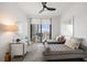 Bright bedroom with two daybeds, a desk, and city views at 100 1St N Ave # 1601, St Petersburg, FL 33701
