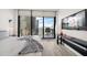 Comfortable bedroom with a king-size bed and city views from balcony at 100 1St N Ave # 1601, St Petersburg, FL 33701