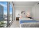 Cozy bedroom with a queen-size bed and city views at 100 1St N Ave # 1601, St Petersburg, FL 33701