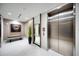 Modern lobby with elevator and seating area at 100 1St N Ave # 1601, St Petersburg, FL 33701