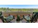 Relaxing balcony featuring two chairs and lush greenery at 12055 Gandy N Blvd # 243, St Petersburg, FL 33702