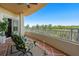 Spacious balcony with patio furniture and scenic nature views at 12055 Gandy N Blvd # 243, St Petersburg, FL 33702