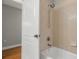 Bathroom with tub, shower, and beige tile at 12055 Gandy N Blvd # 243, St Petersburg, FL 33702