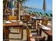 Beachfront restaurant with tables and chairs on the sand at 12055 Gandy N Blvd # 243, St Petersburg, FL 33702