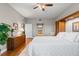 Main bedroom with King bed, built-in wooden cabinet and hardwood floors at 12055 Gandy N Blvd # 243, St Petersburg, FL 33702