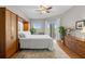 Main bedroom with wood floors, large closet, and access to balcony at 12055 Gandy N Blvd # 243, St Petersburg, FL 33702