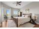 Bright bedroom with a king-size bed and access to a balcony at 12055 Gandy N Blvd # 243, St Petersburg, FL 33702